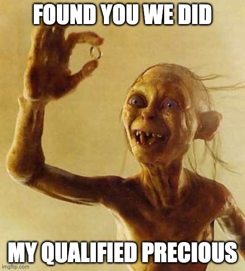 Smeagol looking at the one ring with delight
